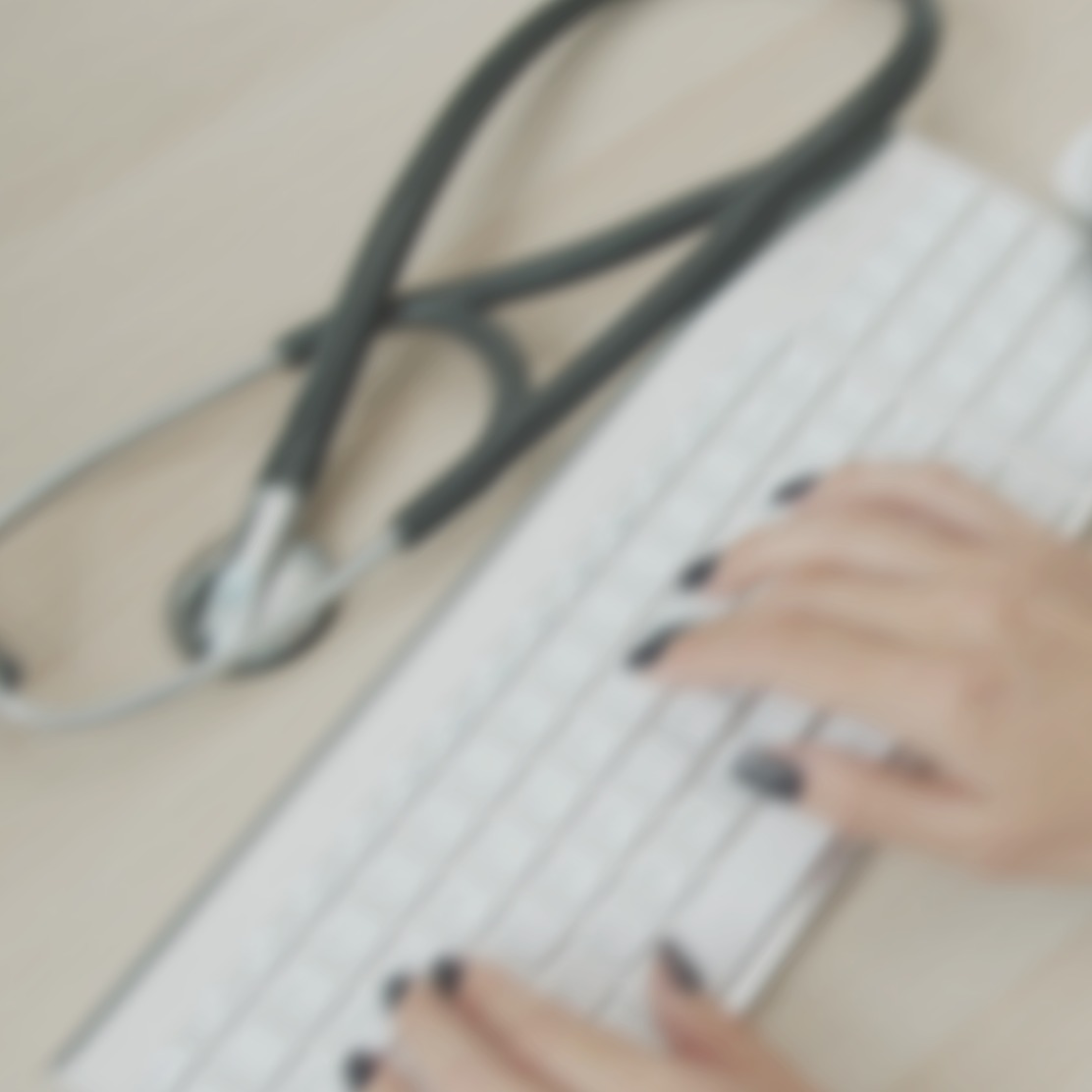 Hands typing on a keyboard